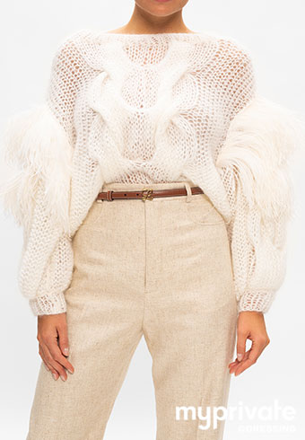 Women white sweater and beige pants with a LOEWE leather belt